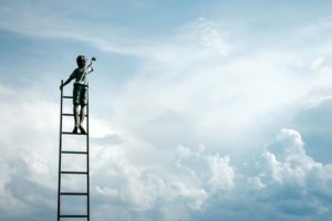 photo of child up ladder reaching for the sky for Continuing Personal Development Plan